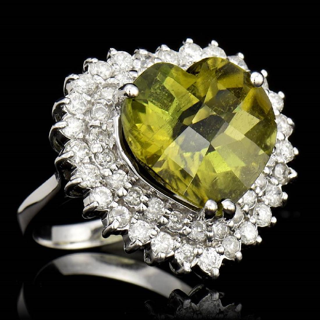 9.94ct Copper Bearing Paraiba Tourmaline 14K White Gold: 14K WHITE GOLD COPPER BEARING PARIBA TOURMALINE RING : 7.04 GRAMS / DIAMOND : 1.52CT / COPPER BEARING PARIBA TOURMALINE : 9.94CT / #GVR1009 **Ideal for channeling nature's healing power, this rare, st