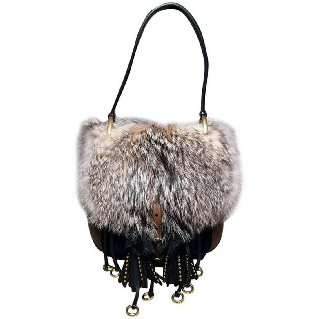 NWOT Prada Fox Fur and Tan Leather Shoulder Bag: AMAZING NWOT Prada Fox Fur and Tan Leather Shoulder Bag in excellent condition. Natural grey fox fur top and back exterior trimmed with black leather top handle, tan leather body and brass hardware. U