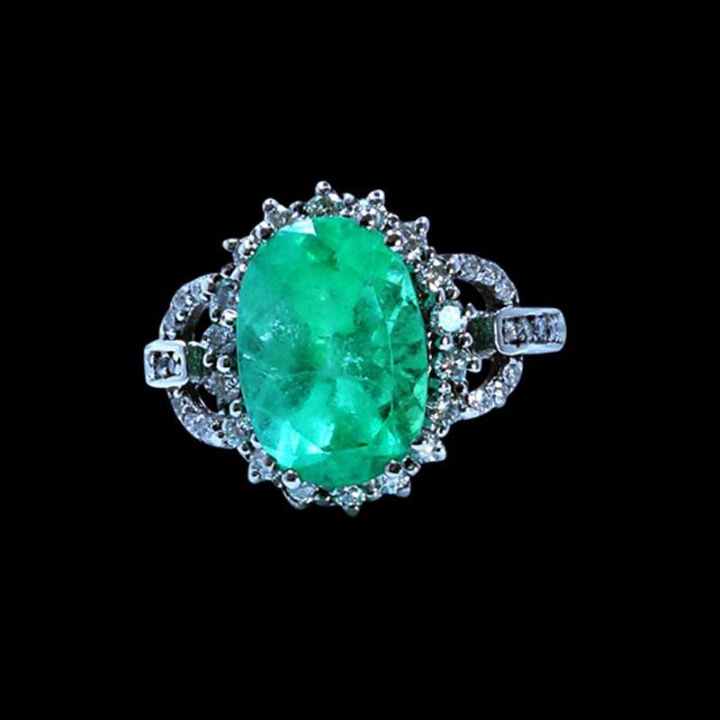 3.92CT NATURAL COLOMBIAN EMERALD 14K WHITE GOLD RING: 14K WHITE GOLD NATURAL COLOMBIAN EMERALD RING :3.38GRAM /EMERALD OVAL :3.92CT/DIAMOND: 0.60CT/#GVR1273 **This 3.92ct oval cut natural Emerald casts a vibrant green hue. Emerald is known to help one st
