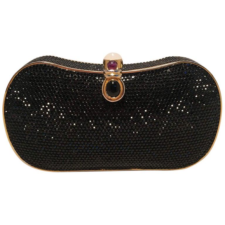 Judith Leiber Black Swarovski Crystal Minaudiere: Judith Leiber Black Swarovski Crystal Minaudiere Evening Bag Clutch in excellent condition. Black swarovski crystal exterior trimmed with gold hardware and a top button closure with coated pearl, purp