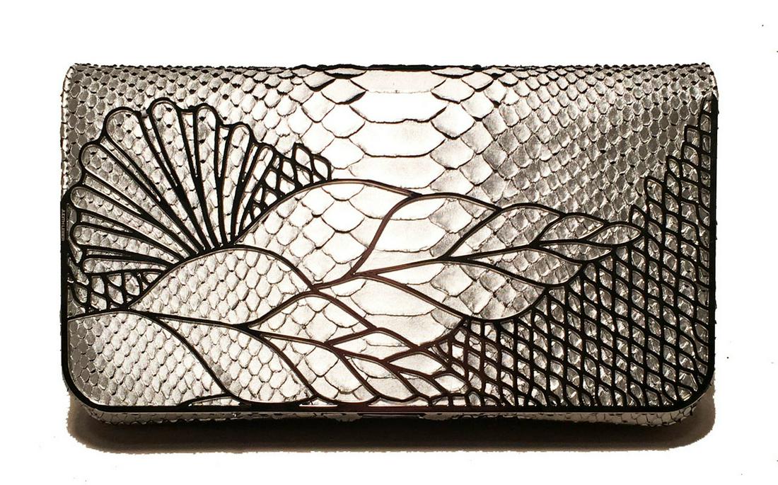 Judith Leiber Silver Faux Snakeskin Python Clutch: stunning Judith Leiber Silver Faux Snakeskin Python Clutch in excellent condition. Silver faux snakeskin python exterior trimmed with silver hardware in a unique cage pattern along the front flap. Sin