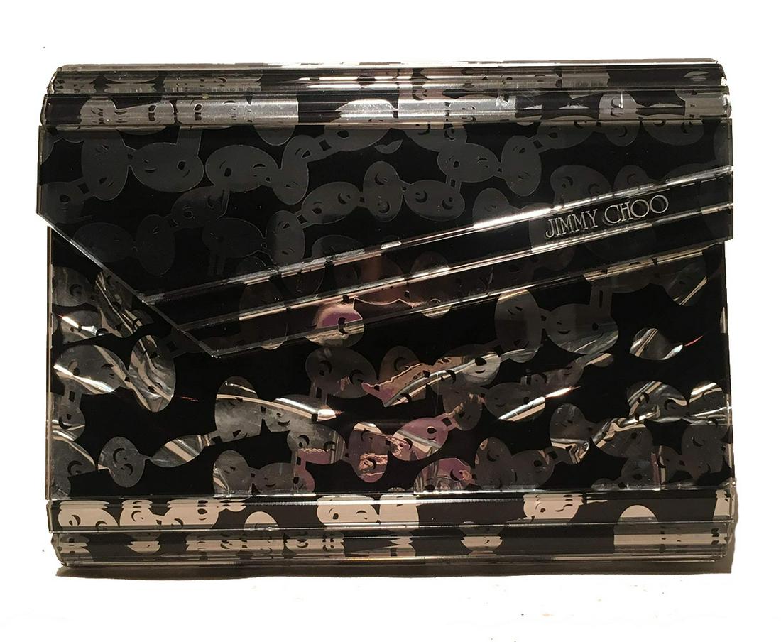 Jimmy Choo Black and Silver Printed Acrylic Clutch: Jimmy Choo Black and Silver Printed Acrylic Clutch in good condition. Black and silver artistic print under clear acrylic. Lifting top flap closure opens to a beige satin interior that holds one side 