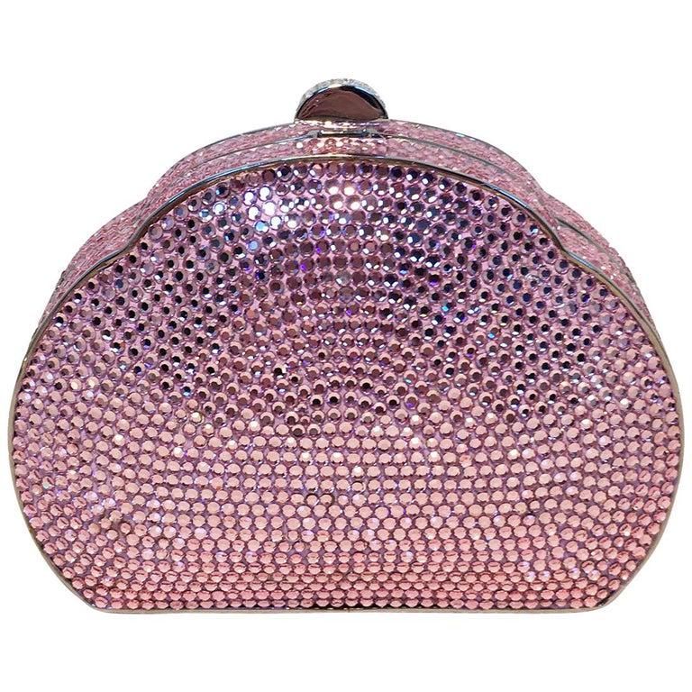 Judith Leiber Pink Swarovski Crystal Minaudiere Evening: Judith Leiber Pink Swarovski Crystal Minaudiere Evening Bag in excellent condition. Pink swarovksi crystal exterior trimmed with silver hardware. Top button closure opens to a silver leather interior