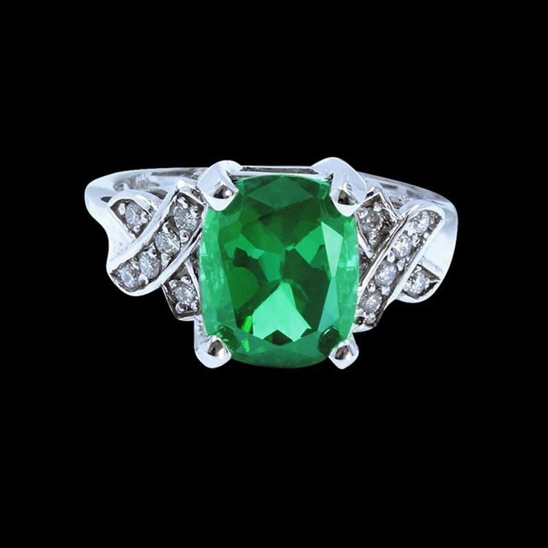 4.29CT NATURAL COPPER BEARING GREEN PARAIBA TOURMALINE: 14K W/G NATURAL COPPER BEARING GREEN PARAIBA TOURMALINE RING: 4.38GRAM /GREEN TOURMALINE :4.29CT/DIAMOND RD :0.17CT/#GVR1305 **The vibrant green hue of this 4.29 carat cushion cut green Tourmaline is 