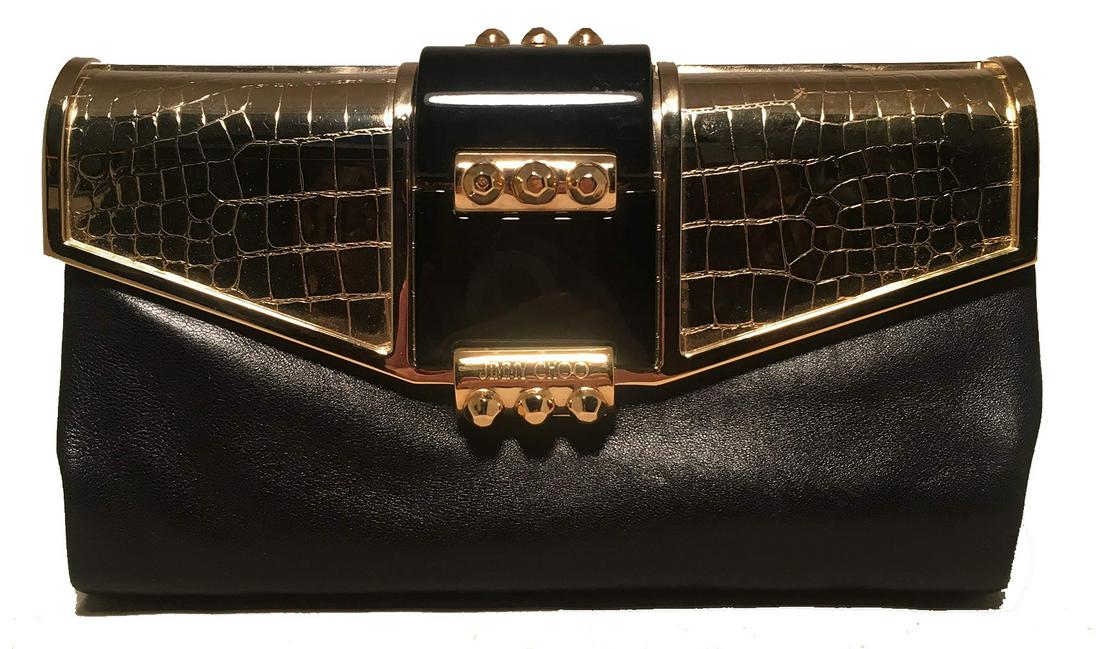 Jimmy Choo Black Leather Gold Alligator Engraved Lift: Jimmy Choo Black Leather Gold Alligator Engraved Lift Top Clutch in very good condition. Soft black leather exterior trimmed with gold engraved metal lift top with black enamel and gold rivet embellis