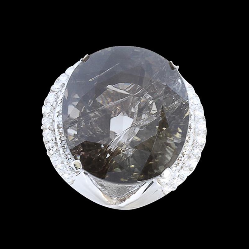 57.15CT NATURAL TOURMALINE 14K W/G RING: 14K W/G NATURAL TOURMALINE RING: 17.05GRAM/TOURMALINE :57.15CT/ DIAMOND RD :1.36CT/#GVR1295 **One of the premiere stones for self-healing, this massive 57.14 carat oval cut Champagne Color Natural Tou