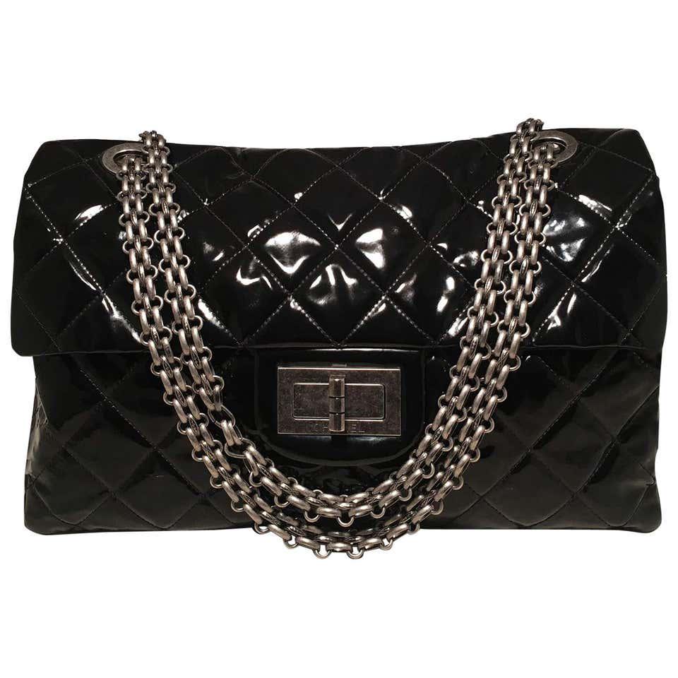 Chanel 2.55 Reissue Classic Flap Oversized Xxl Black: CHANEL black patent XXL classic shoulder bag tote. Black quilted patent leather exterior with gunmetal hardware. Mademoiselle style front closure opens single flap style to a black nylon lined interio