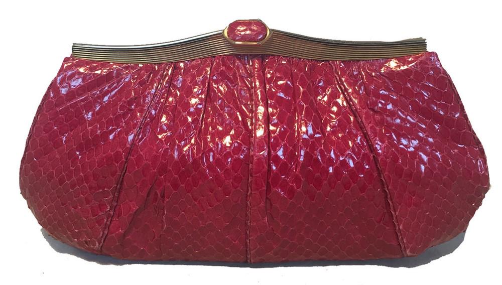 Judith Leiber Vintage Maroon Rose Snakeskin Clutch: BEAUTIFUL Judith Leiber Maroon snakeskin clutch in very good vintage condition. Maroon snakeskin exterior trimmed with gold hardware. Top lifting closure opens to a burgundy satin lined interior that
