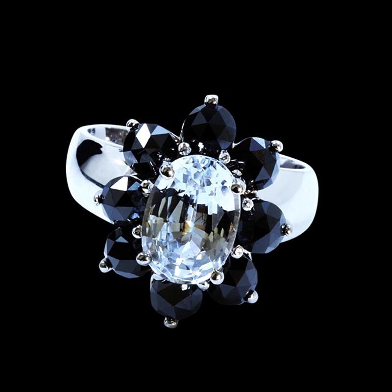 2.93CT NATURAL CEYLON WHITE SAPPHIRE 14K WHITE GOLD: 14K WHITE GOLD NATURAL CEYLON WHITE SAPPHIRE RING:5.55 GRAMS/NATURAL CEYLON WHITE SAPPHIRE:2.93CT/BLACK DIAMOND:2.85CT/#GVR1062 **This glorious, shining 2.93ct Oval Cut Natural White Sapphire, known f