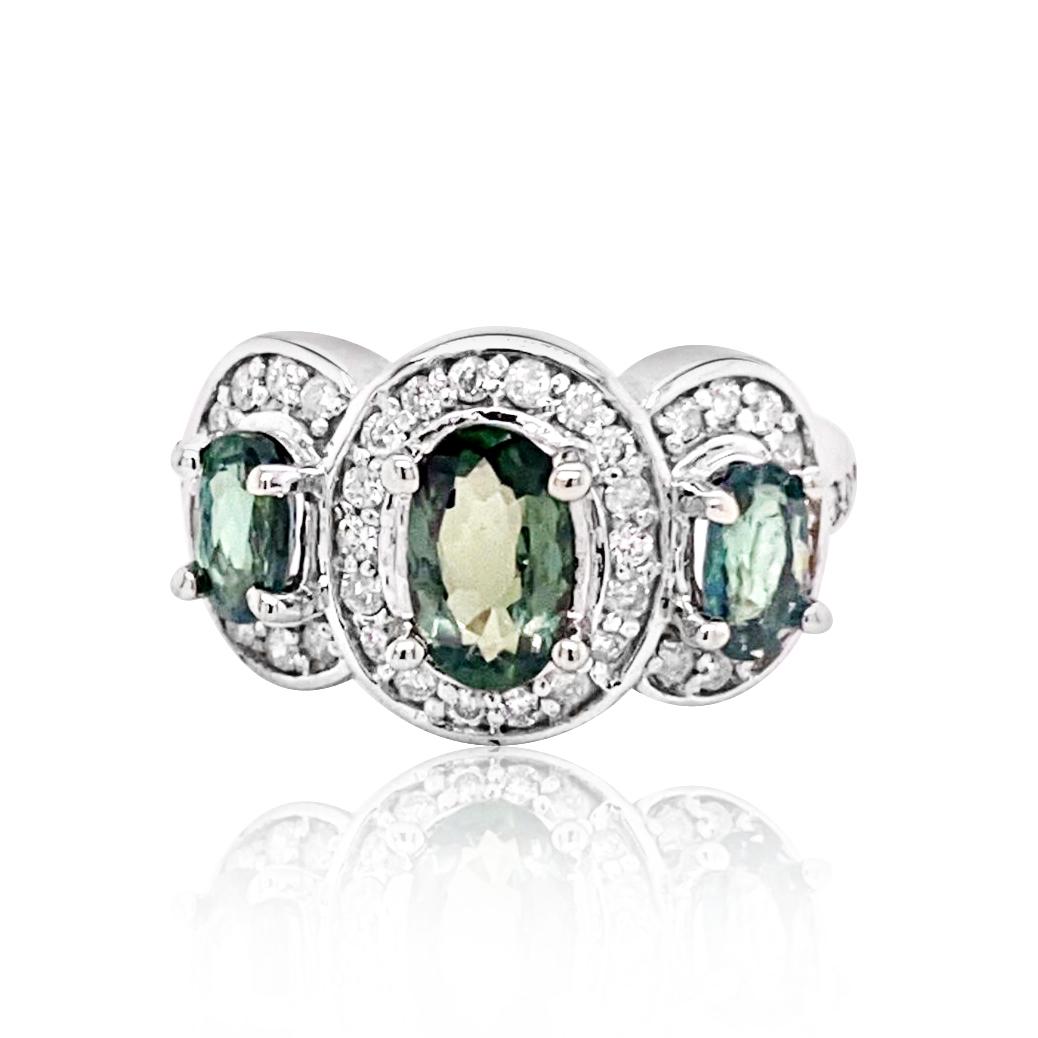 1.88CT NATURAL Alexandrite 14K W/G RING: 14K W/G NATURAL Alexandrite RING :5.96GRAM /ALEXANDRITE: 1.88CT/DIAMOND RD :0.53CT/#GVR1290 **A delightful trio of 1.88 carat oval cut natural Alexandrite are encircled with shimmering halos of 1.88 c