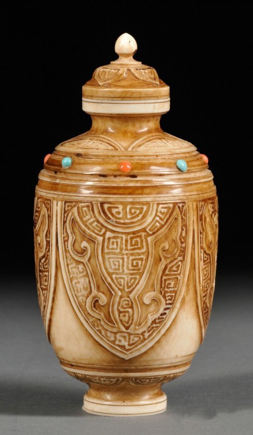 Large Ivory Snuff Bottle, China, 20th century: Large Ivory Snuff Bottle, China, 20th century, Mughal-style with carved taotie masks, inlaid with turquoise and coral, with stopper, ht. 4 3/4 in.*NOTE: This lot cannot be shipped to any U.S state or
