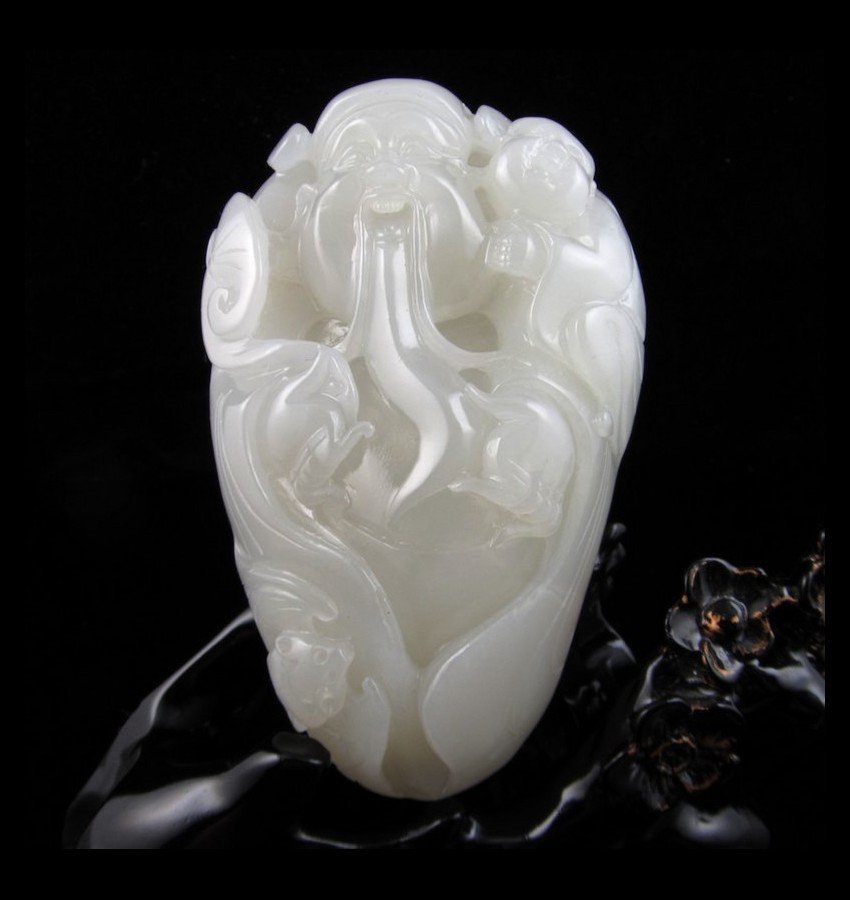 A LARGE WHITE JADE 'SHOUXING' WITH ZITAN BASE (1 of 4)