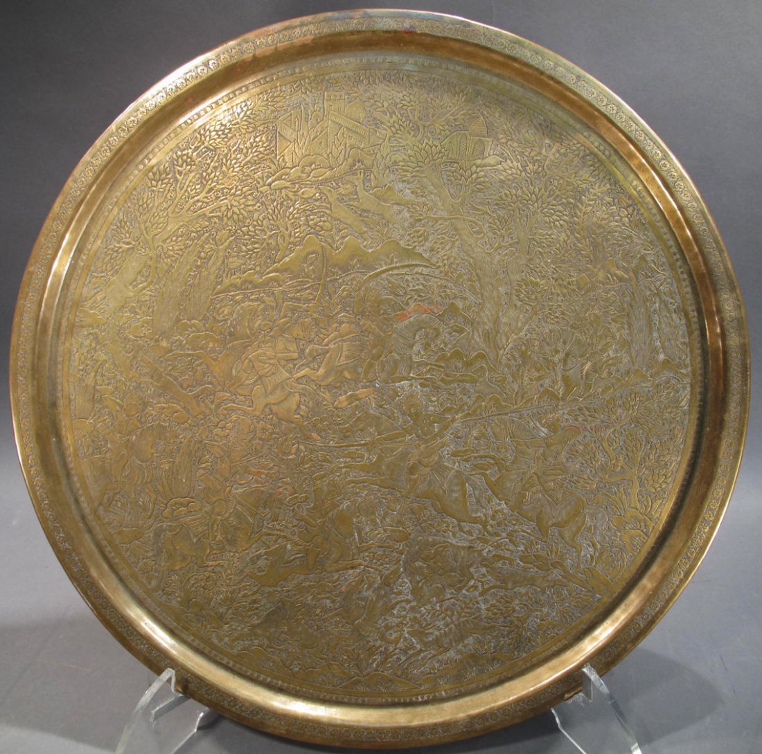 LARGE BRASS TRAY. Engraved with mythological creatures: LARGE BRASS TRAY. Engraved with mythological creatures and soldiers. 19 1/2".