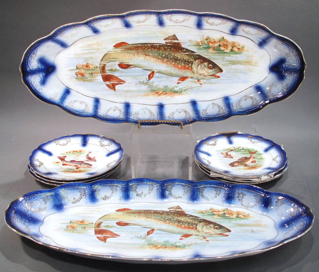 SET OF SIX FLOW BLUE STERLING CHINA FISH PLATES.: SET OF SIX FLOW BLUE STERLING CHINA FISH PLATES. Together with two flow blue fish platters.
