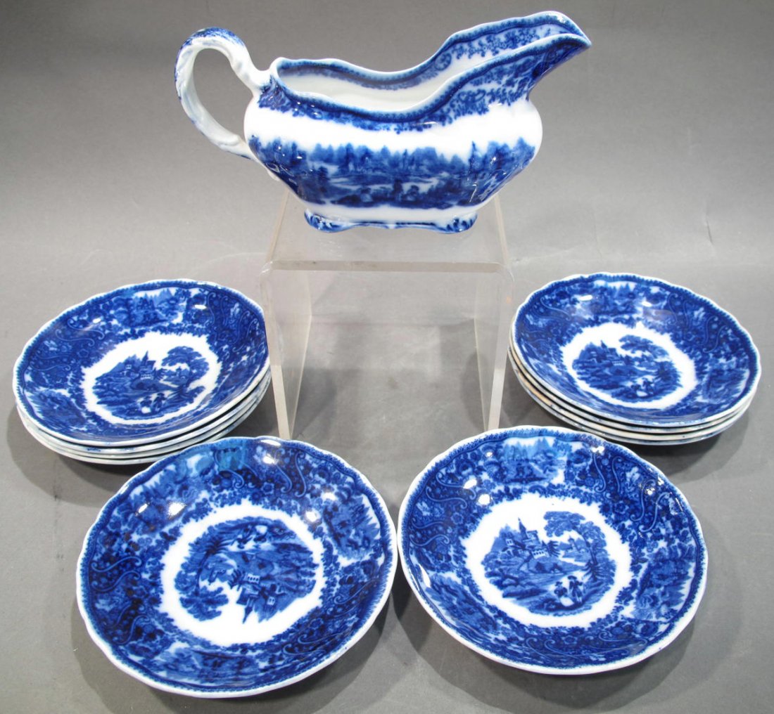 FLOW BLUE NON PARIEL GRAVY BOAT BY BURGESS & LEIGH, 7: FLOW BLUE NON PARIEL GRAVY BOAT BY BURGESS & LEIGH, 7 1/2"FROM SPOUT TO HANDLE. Together with 10 non pariel flow blue dessert plates. (Note: light wear and paint chips).