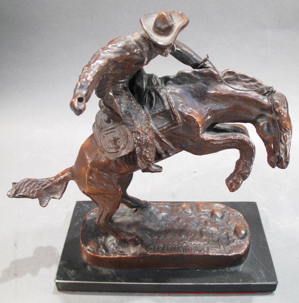 BRONZE COWBOY ON HORSE. After Reminton on black base.: BRONZE COWBOY ON HORSE. After Reminton on black base. 11"h. "Bucking Bronco".