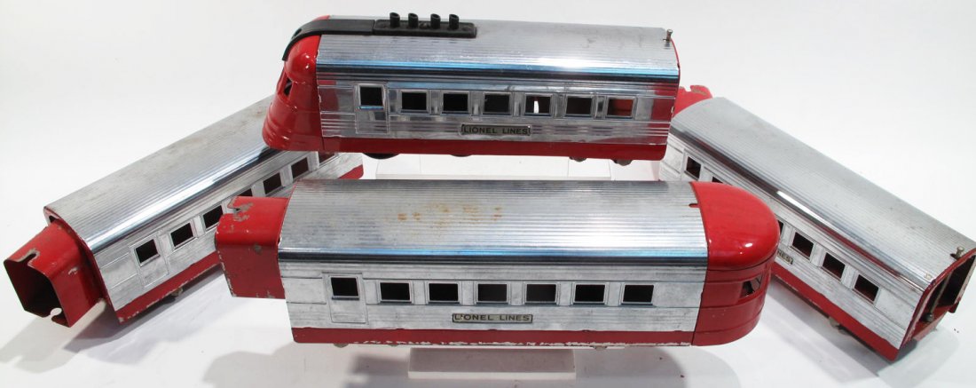 LIONEL PASSENGER TRAIN SET. Including one engine and: LIONEL PASSENGER TRAIN SET. Including one engine and three cars.
