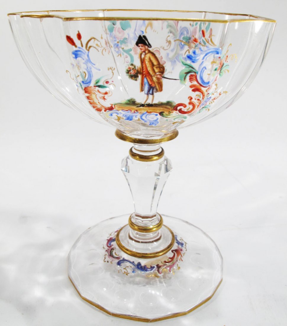 FOOTED VENETIAN GLASS COMPOTE. With scalloped gold: FOOTED VENETIAN GLASS COMPOTE. With scalloped gold rim, reverse figural decorated with enamel reserves and flowers on a circular scalloped base. 4 3/4"h.
