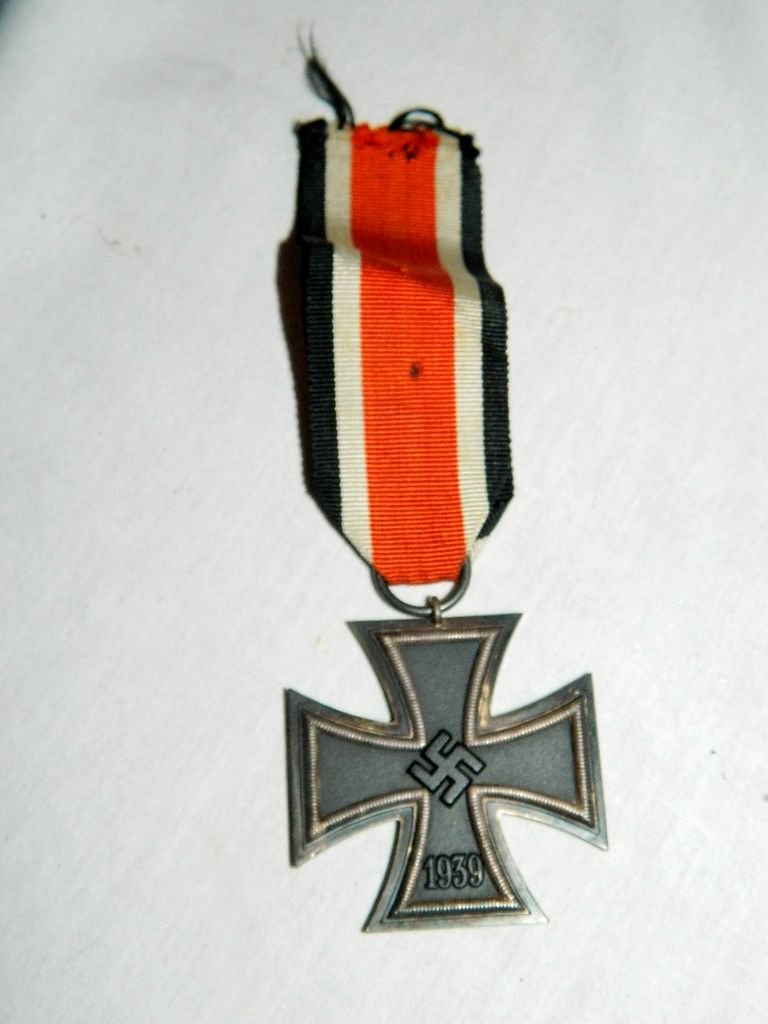 1939 German Iron Cross Medal by Schinkle.: This is the 2nd class medal. Marked 1939 front side and 18013 back side. Light fading to ribbon with some light soiling and fraying to the ends. Light scratches to metal and discoloration of ring from