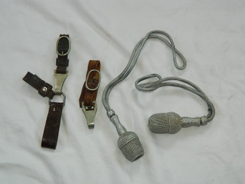 WWII German Silver Bullion Portepee & Leather Hangers: This lot contains a set of 2 original WWII German silver bullion portepees for Nazi Luftwaffe 1st and 2nd model daggers. Lot also comes with 2 leather hangers. Single hanger made of blackened leather 