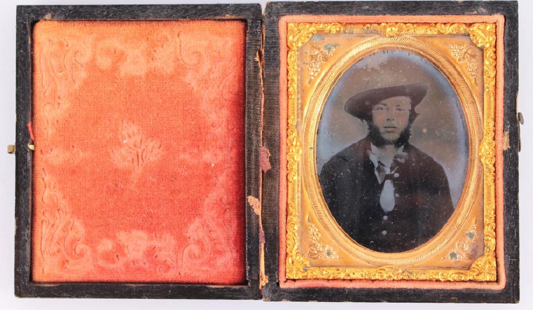 CIVIL WAR ERA HAND COLORED YOUNG MAN TINTYPE: CIVIL WAR ERA HAND COLORED YOUNG MAN TINTYPE Hand colored Civil War era tintype depicting a young man, set in velvet and wood case. Size: 3" Shipping / Pickup: We Can Ship This Item Hand colored Civil