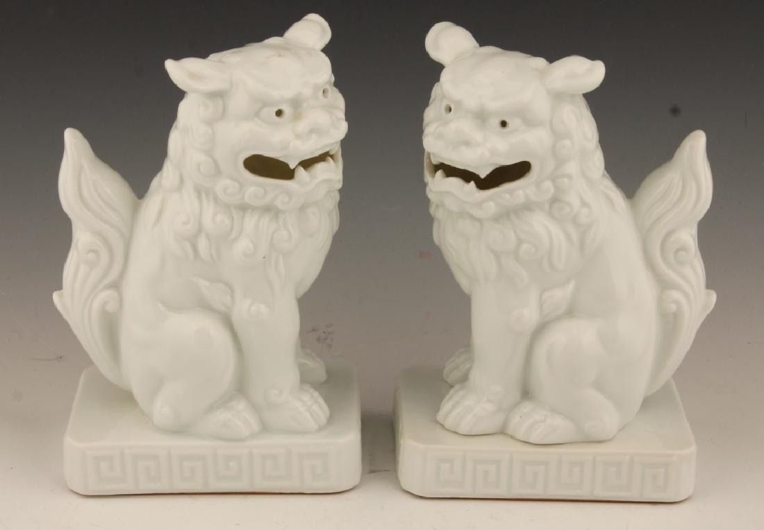 PAIR OF WHITE PORCELAIN FOO DOGS: PAIR OF WHITE PORCELAIN FOO DOGS Pair of white porcelain foo dogs. Made in Japan. Size: 7.25" Shipping / Pickup: Buyer Pick Up, 3rd Party