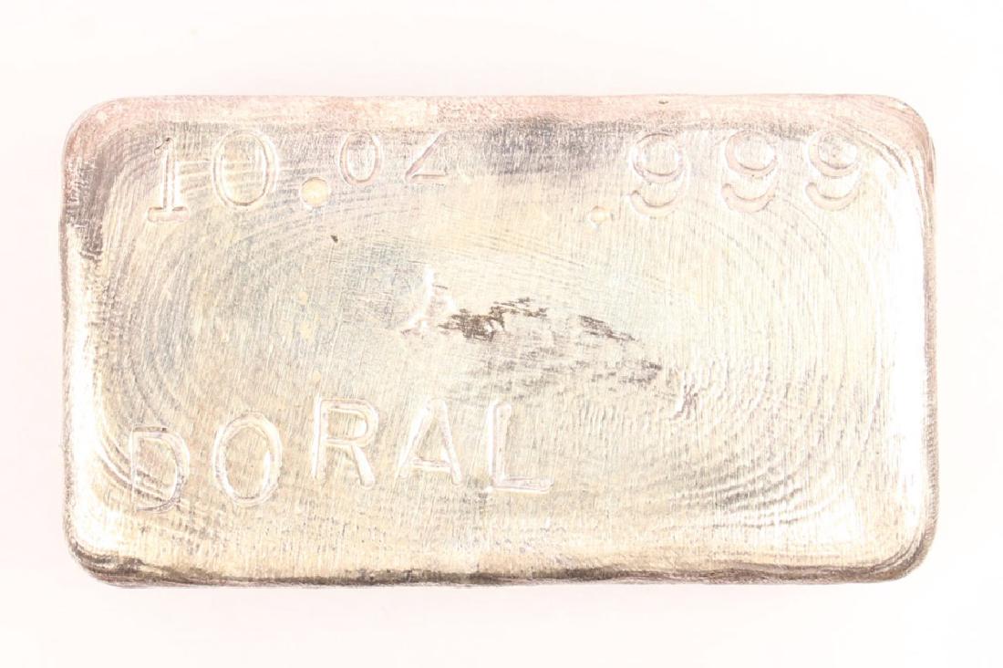 .999 SILVER 10 OZ. DORAL SILVER BAR: .999 SILVER 10 OZ. DORAL SILVER BAR 10 Oz. .999 Silver bar, marked "DORAL". Weight: 10 OZ. Shipping / Pickup: We Can Ship This Item