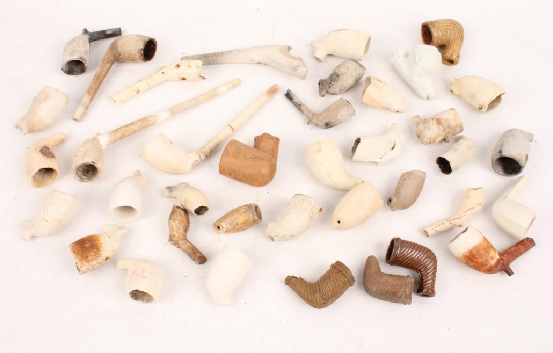 MIXED KAOLIN PIPE FRAGMENTS: MIXED KAOLIN PIPE FRAGMENTS Mixed kaolin pipe fragments, each varying sizes and designs. Shipping / Pickup: Buyer Pick Up, 3rd Party
