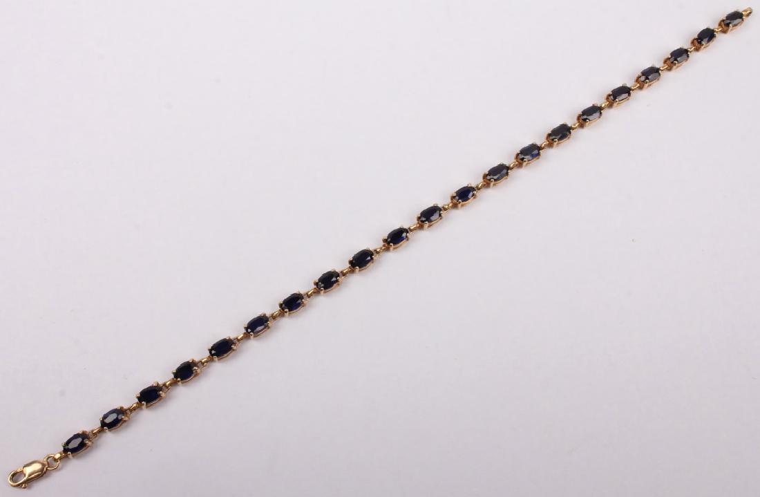 10K YELLOW GOLD BLUE SPINEL BRACELET: 10K YELLOW GOLD BLUE SPINEL BRACELET 10K yellow gold bracelet with 21 oval cut blue spinel. Weight: 4.8 grams Size: 7" Shipping / Pickup: We Can Ship This Item