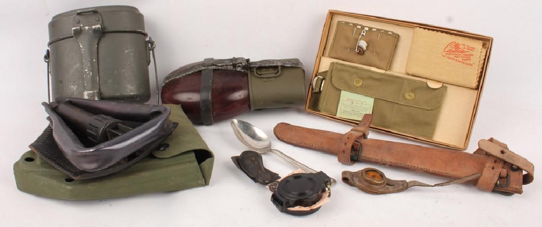 MIXED LOT OF MOSTLY WWII MILITARIA: MIXED LOT OF MOSTLY WWII MILITARIA Lot of mixed primarily WWII era military items including a scabbard, pistol grips, boxed soldiers kit, German canteen, 2 compasses, and one mess kit. Shipping / Pick