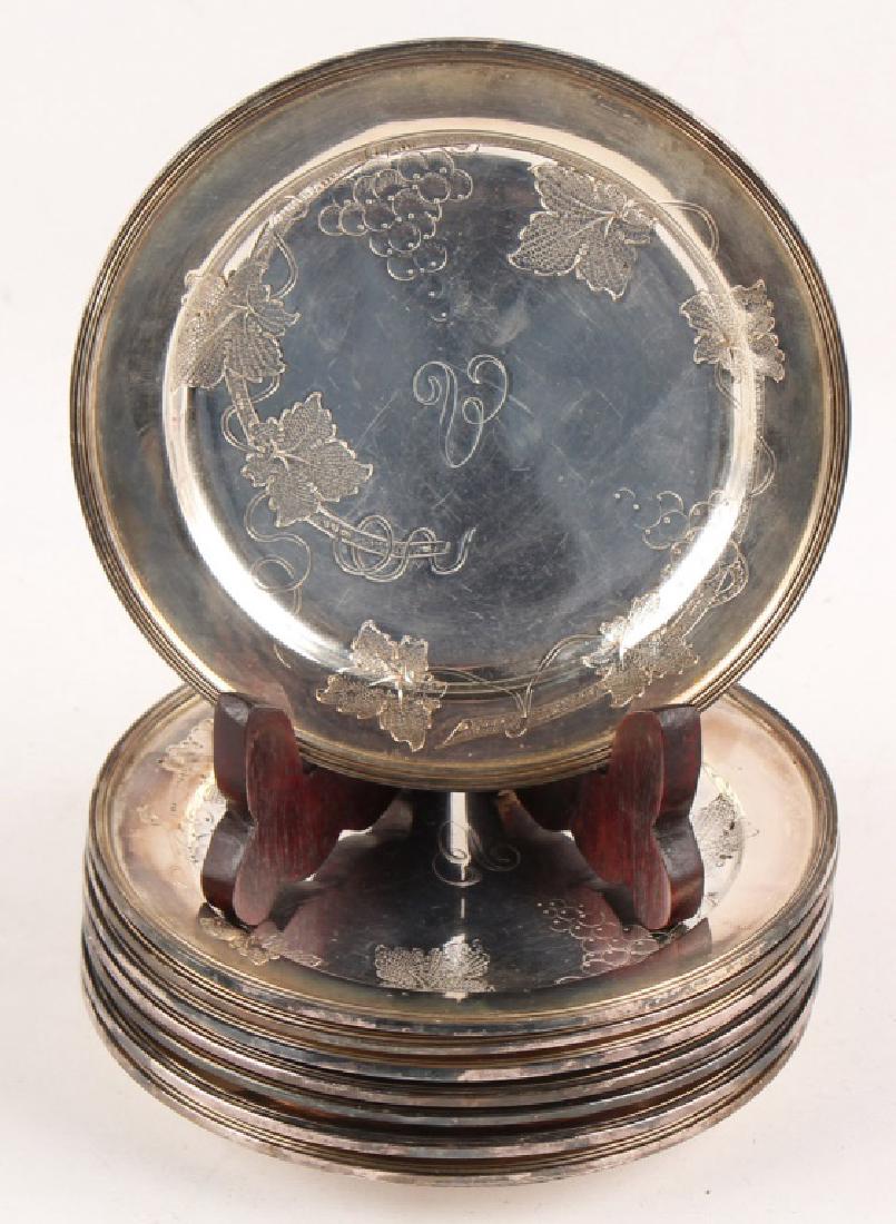 SET OF 8 SILVER PLATE GRAPEVINE WINE COASTERS 5028: SET OF 8 SILVER PLATE GRAPEVINE WINE COASTERS 5028 Set of 8 silver plated wine coasters with grapevine design on obverse. Lot Location: #1 - Manor's Gallery Weight: 220.5 grams Size: 6.25" Shipping /