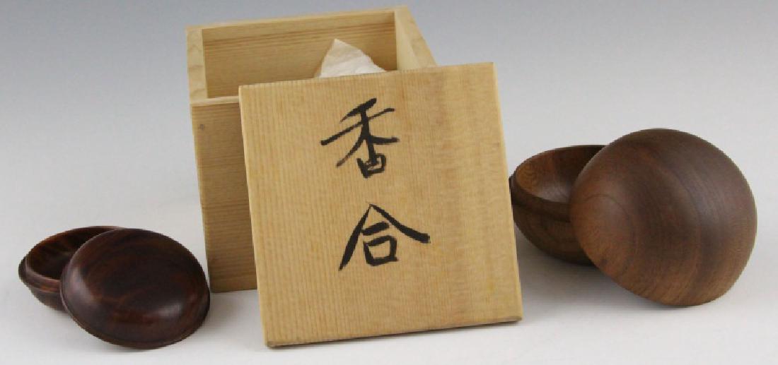 (2) JAPANESE WOOD KOGO INCENSE BOX: (2) JAPANESE WOOD KOGO INCENSE BOX Two Japanese wooden kogo incense boxed, smallest is 2", largest is 2.25" and includes calligraphic storage box. Shipping / Pickup: Buyer Pick Up, 3rd Party