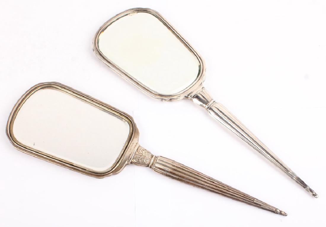 2 STERLING SILVER WEIGHTED HAND MIRRORS: 2 STERLING SILVER WEIGHTED HAND MIRRORS Lot of 2 sterling silver 20th Century hand mirrors, one Birks Sterling and one Saart Brothers Sterling. Lot Location: #1 - Manor's Gallery Weight: 574.8 grams S