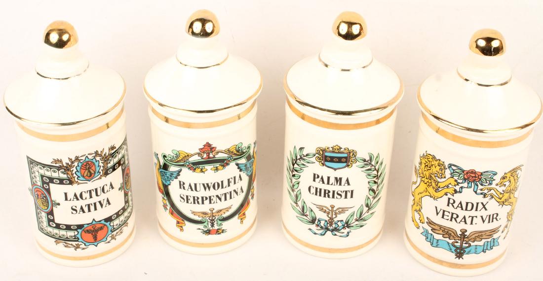 4 PORCELAIN JEANNE ROBINETTE APOTHECARY JARS: 4 PORCELAIN JEANNE ROBINETTE APOTHECARY JARS Lot of four 20th Century Jeanne Robinette porcelain apothecary jars, Radix Verat Vir., Palma Christi, Lactuca Sativa, and Rauwolfia Serpentina. Size: 11" S