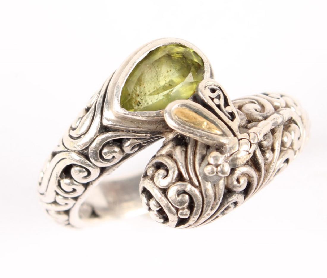 LADIES P&G 18K GOLD & STERLING SILVER PERIDOT RING: LADIES P&G 18K GOLD & STERLING SILVER PERIDOT RING Ladies singed PG sterling silver and 18K yellow gold accented ring with dragonfly motif and Peridot accent. Weight: 8.6 grams Size: 8.5 Shipping / Pi