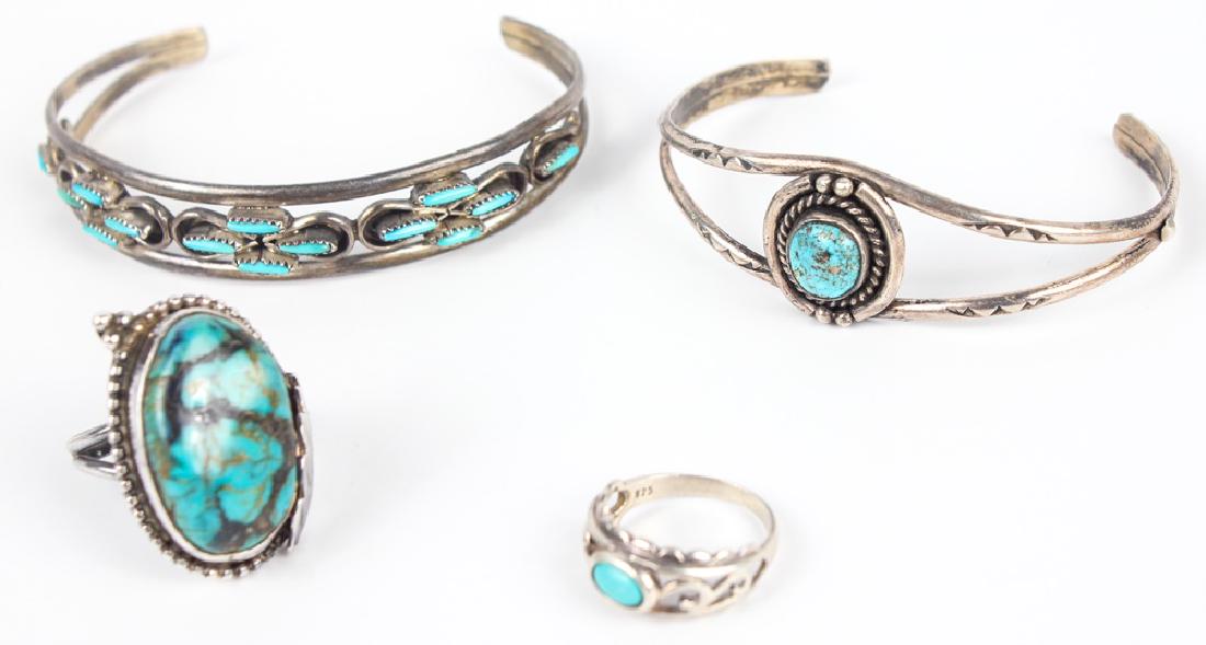 4 STERLING SILVER TURQUOISE JEWELRY: 4 STERLING SILVER TURQUOISE JEWELRY Four pieces of sterling silver jewelry with turquoise; to include two rings and two cuff bracelets. Not marked, tested. Weight: 32.1 grams Shipping / Pickup: We Can