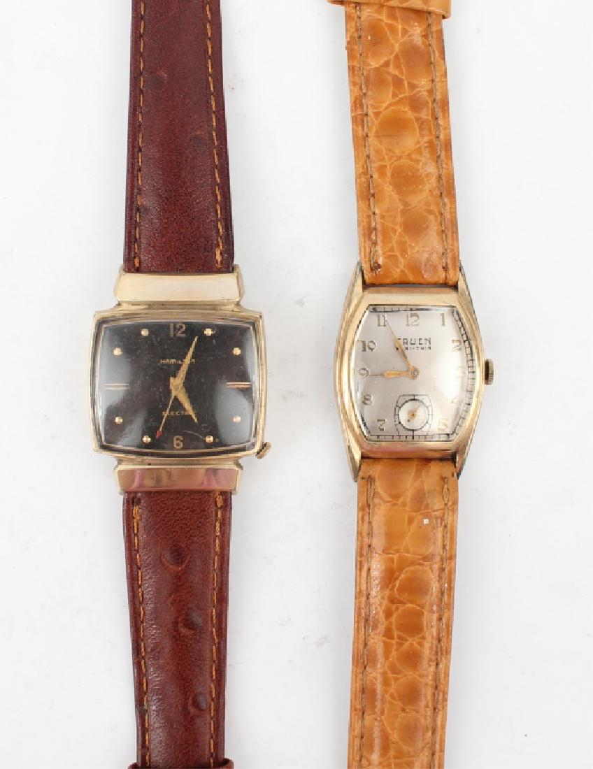 TWO MEN'S ANTIQUE GOLD FILLED WRISTWATCHES: TWO MEN'S ANTIQUE GOLD FILLED WRISTWATCHES Lot of two 20th Century wrist watches, one 10k gold filled Hamilton Electric and one gold plated Gruen Veri-thin with a cal. 406 movement. Weight: 56.5 grams
