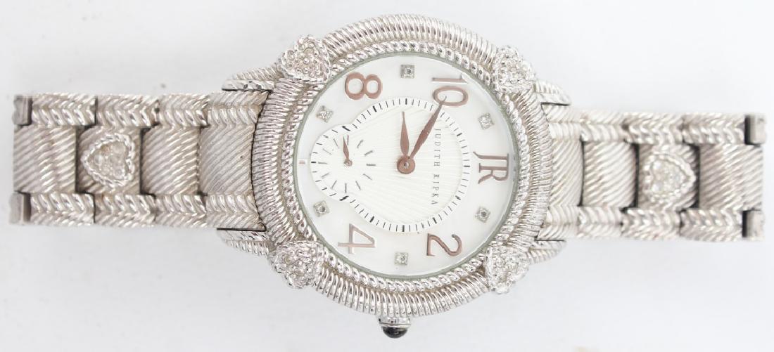 LADIES JUDITH RIPKA STERLING SILVER WRISTWATCH: LADIES JUDITH RIPKA STERLING SILVER WRISTWATCH Ladies sterling silver cased Swiss movement wristwatch and steel bracelet. Weight: 91.9 grams Size: 35mm Shipping / Pickup: We Can Ship This Item
