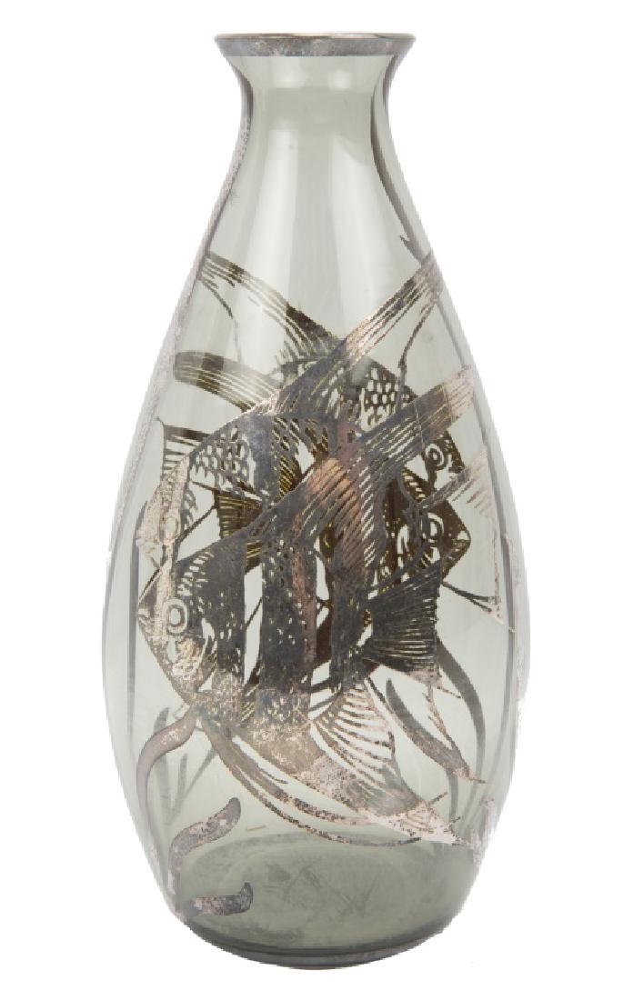 STERLING WRAPPED GLASS FISH MOTIF VASE: STERLING WRAPPED GLASS FISH MOTIF VASE Sterling silver overlaid art glass vase with Moorish Idol motif to sides. Size: 8.5 x 4 x4" Shipping / Pickup: We Can Ship This Item
