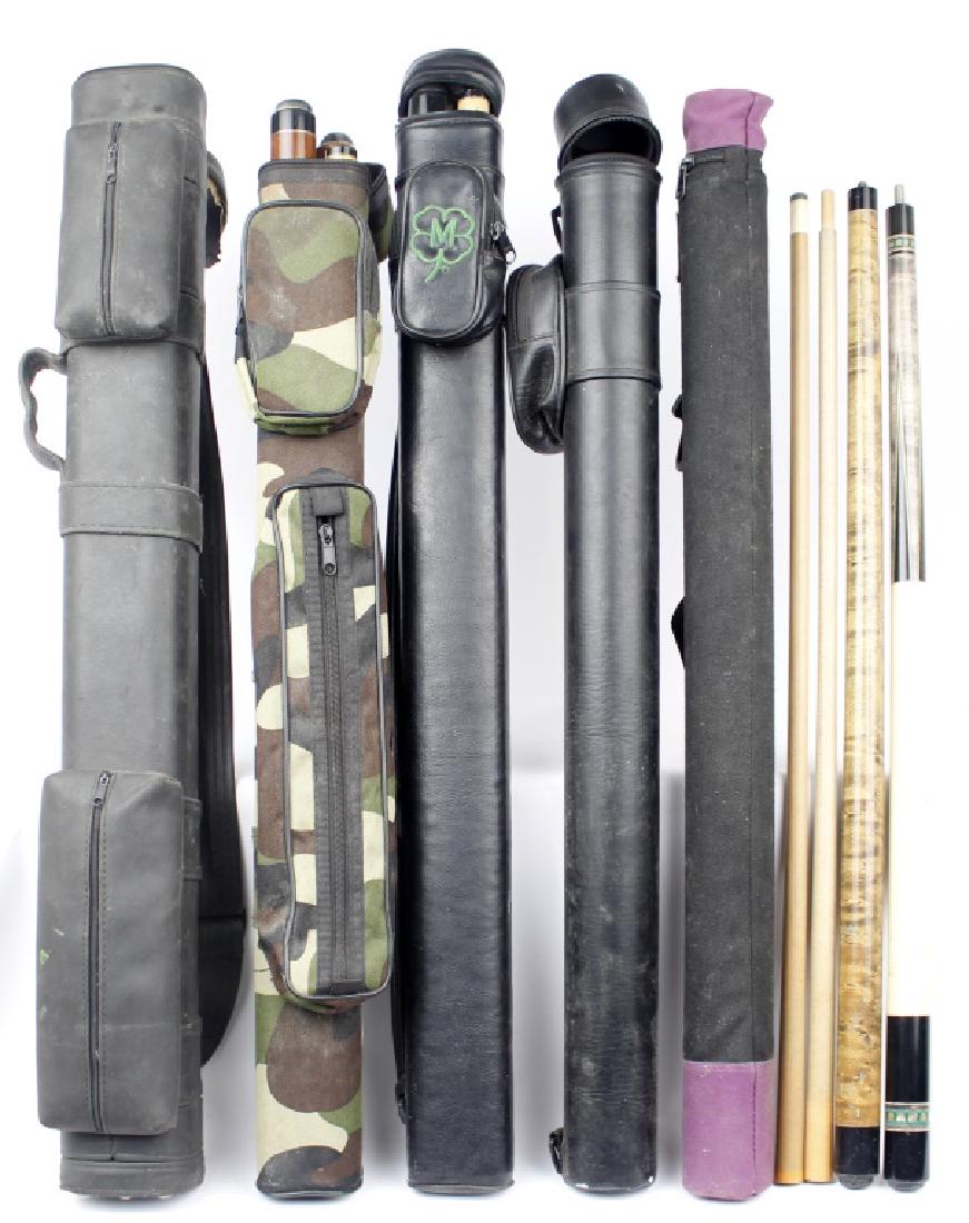 POOL CUE STICKS AND CASES LOT OF 5: POOL CUE STICKS AND CASES LOT OF 5 Lot of five two-piece pool cues. Brands include Meucci, Stratford; and McDermott decorated with wolf art. Five cases, two marked, Viper Q Vault and McDermott. Size: