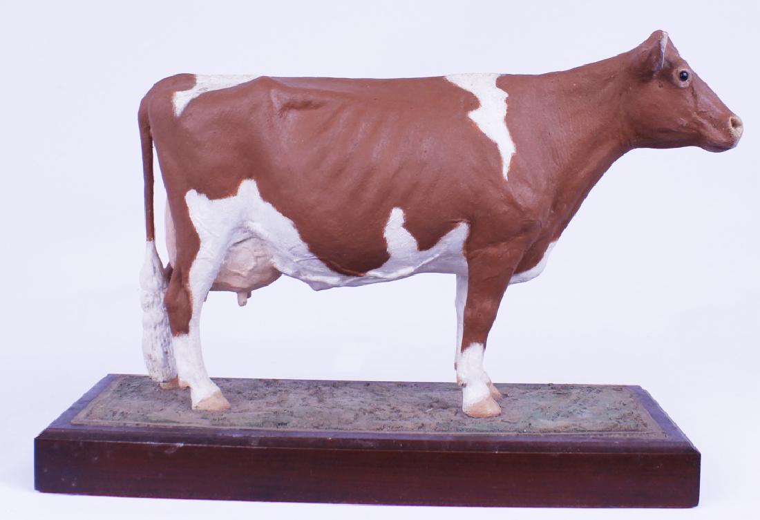 LOUIS PAUL JONAS STUDIOS COW FIGURINE: LOUIS PAUL JONAS STUDIOS COW FIGURINE One figurine of a cow who is utterly out-standing in it's field. Marked Louis Paul Jonas Studios F.N. Eustis SC 1086. Limited Edition 11/200. Size: 8 Shipping / P