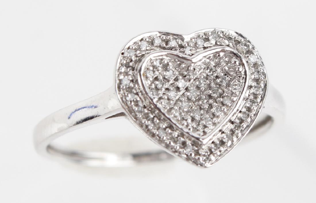 LADIES 10K WHITE GOLD DIAMOND HEART RING: LADIES 10K WHITE GOLD DIAMOND HEART RING Ladies 10k white gold with micro pave diamond cluster heart. .10ctw cluster of micro pave round white diamonds. Weight: 1.5 g Size: 7
