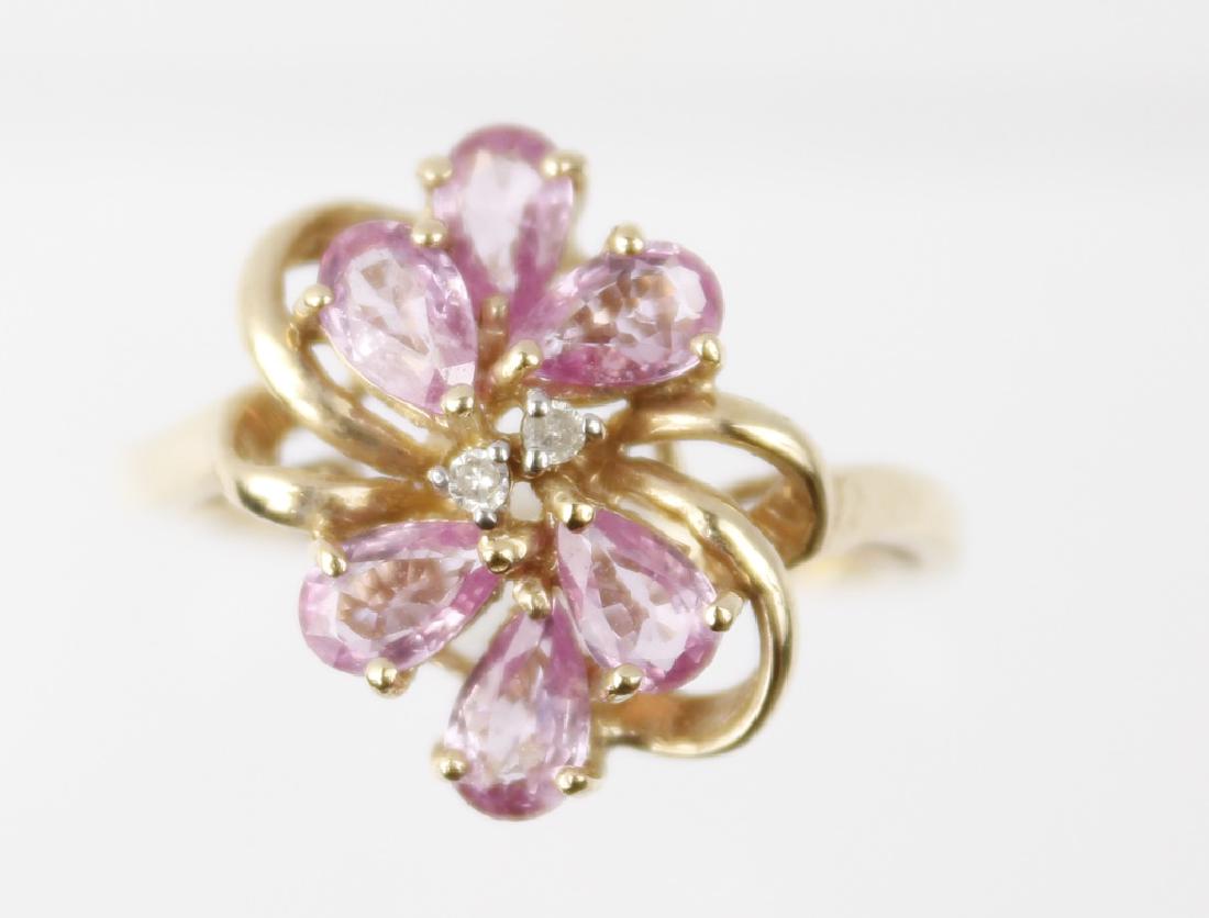 10K YELLOW GOLD PINK TOPAZ CLUSTER RING: 10K YELLOW GOLD PINK TOPAZ CLUSTER RING 10k yellow gold pink topaz cluster ring. (6) pear shaped pink topaz. Weight: 2.6 g Size: 6