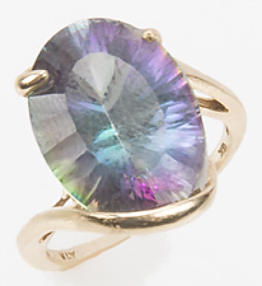 LADIES 10K YELLOW GOLD MYSTIC TOPAZ RING: LADIES 10K YELLOW GOLD MYSTIC TOPAZ RING Ladies 10k yellow gold Mystic topaz ring. Mystic topaz is prong set 11mm x 15mm. Weight: 3.8 G Size: 6