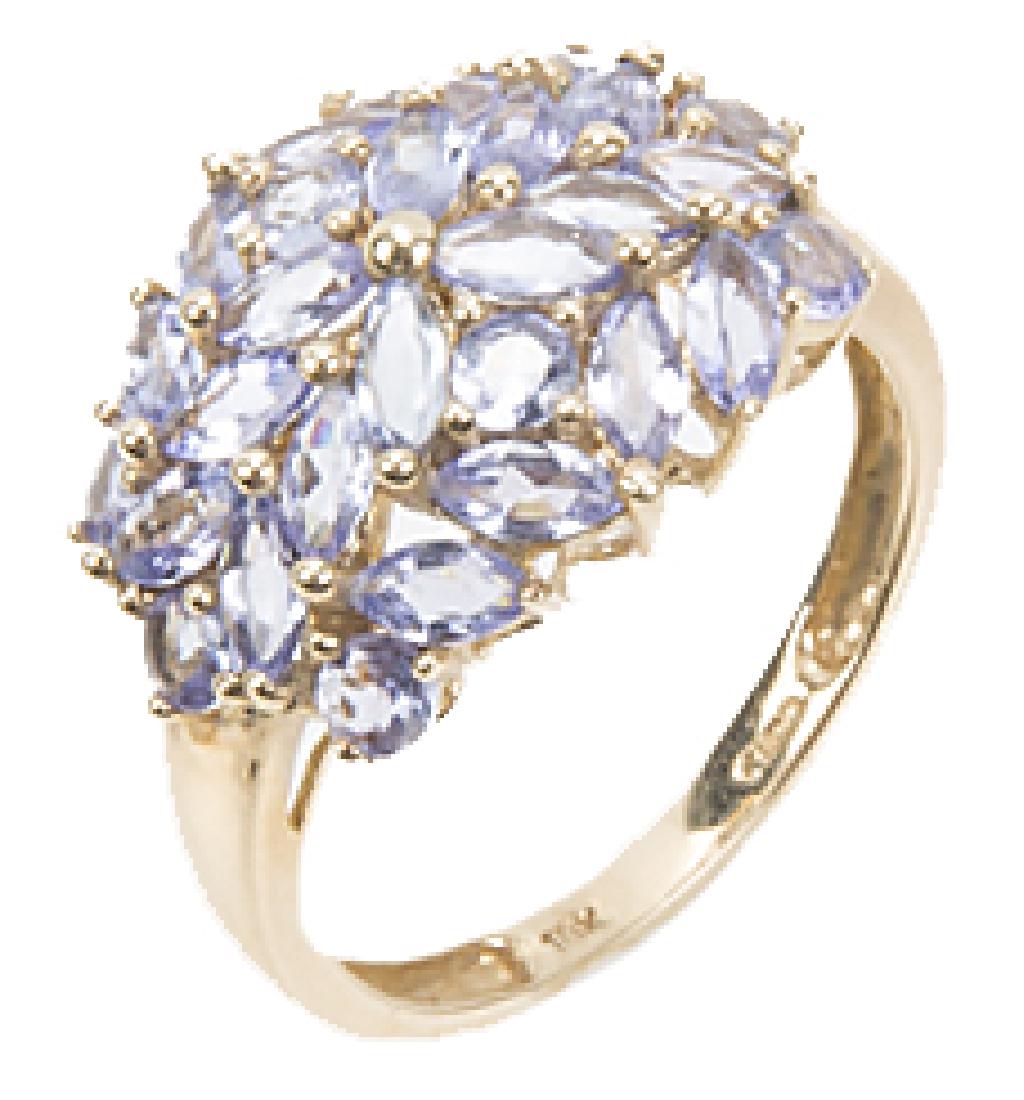 10K YELLOW GOLD TANZANITE FASHION RING: 10K YELLOW GOLD TANZANITE FASHION RING Ladies 10k yellow gold synthetic tanzanite fashion ring. Weight: 3.2 g Size: 7