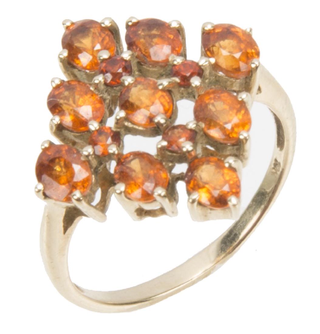 10K YELLOW GOLD MANDARIN GARNET CLUSTER RING: 10K YELLOW GOLD MANDARIN GARNET CLUSTER RING 10k yellow gold mandarin garnet cluster ring. (9) oval cut garnets, (4) round cut. Weight: 2.8 g Size: 6