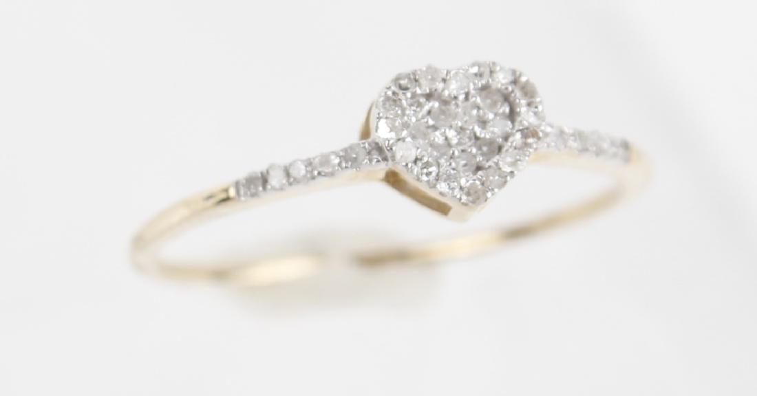 LADIES 10K YELLOW GOLD DIAMOND RING: LADIES 10K YELLOW GOLD DIAMOND RING Ladies 10k yellow gold diamond promise ring. Micro Pave heart shaped cluster .09CTW. Weight: .94 g Size: 7