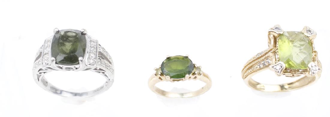 14K GOLD LADIES FASHION RINGS - LOT OF 3: 14K GOLD LADIES FASHION RINGS - LOT OF 3 Lot of three 14k gold ladies fashion rings. (1) oval green Peridot, (1) oval synthetic emerald, (1) cushion cut Peridot. Weight: 10 g