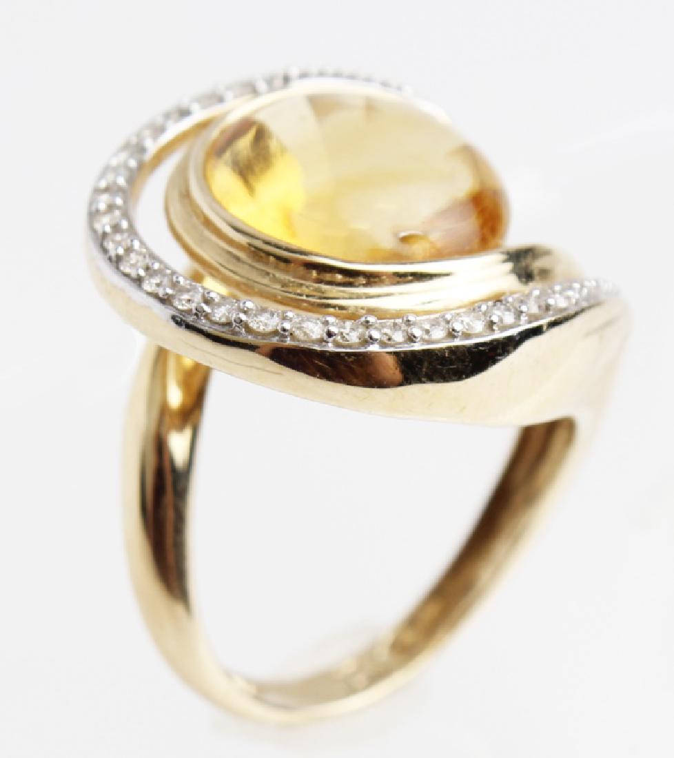 14K YELLOW GOLD CITRINE LADIES FASHION RING: 14K YELLOW GOLD CITRINE LADIES FASHION RING 14k yellow gold with citron center stone and diamond accents ladies fashion ring. Weight: 6.5 g
