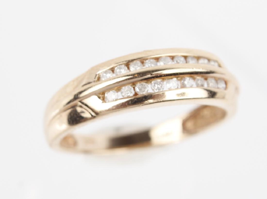 LADIES 14K YELLOW GOLD DIAMOND BAND RING: LADIES 14K YELLOW GOLD DIAMOND BAND RING Ladies 14k yellow gold diamond ring. Two rows of (9) .01ct round brilliant white diamonds. .18Ctw diamonds bezel set. Weight: 3.70 g Size: 9